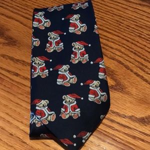 Stringbeans Christmas Bear tie. 4” wide. Features s bear in a red jacket & hat.